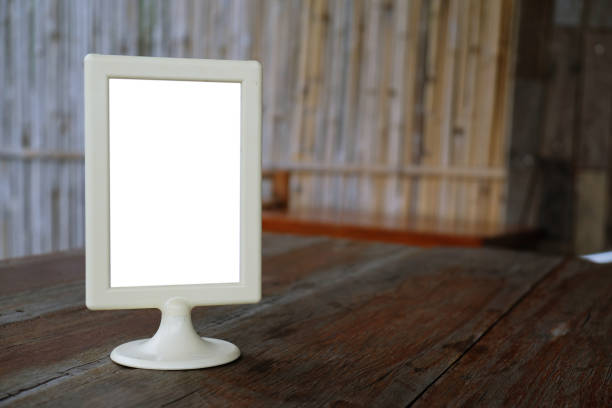 istock Menu frame standing on wood table in Bar restaurant cafe. space for text marketing promotion. 1090431204
