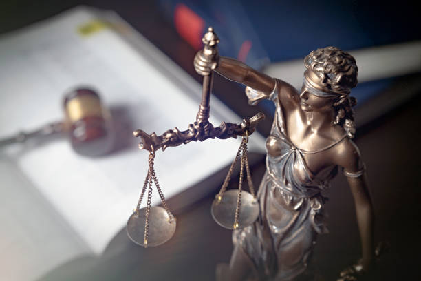 istock Statue of justice on books background 1090431458