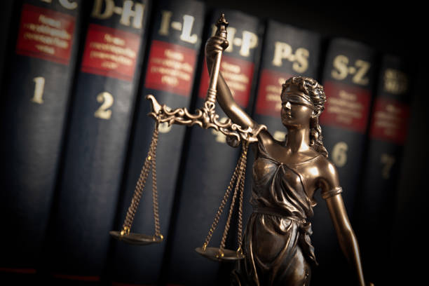 istock Statue of justice on books background 1090431478