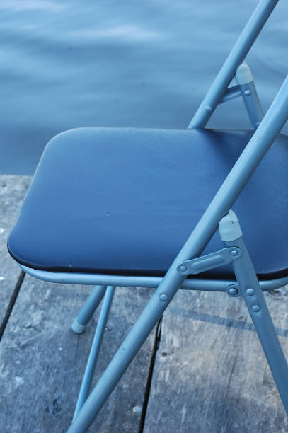 istock A simple black metal chair on the pier. 1090436430