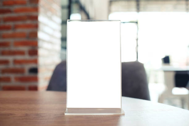 istock Menu frame standing on wood table in Bar restaurant cafe. space for text marketing promotion. 1090440258