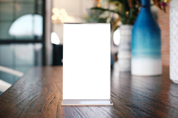 istock Menu frame standing on wood table in Bar restaurant cafe. space for text marketing promotion. 1090440262