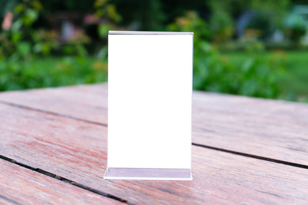 istock Menu frame standing on wood table in Bar restaurant cafe. space for text marketing promotion. 1090440424