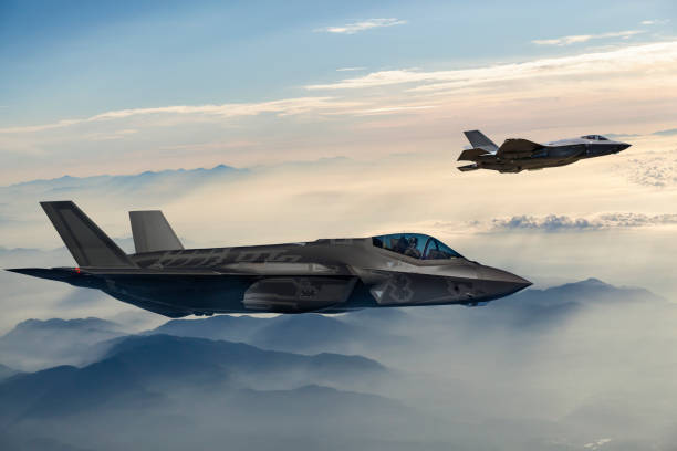istock Fighter Jets flying over the fogy mountains at dusk 1090442902
