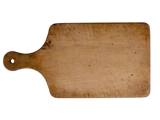 Vintage kitchenware. Old wood cutting or chopping board isolated on white.