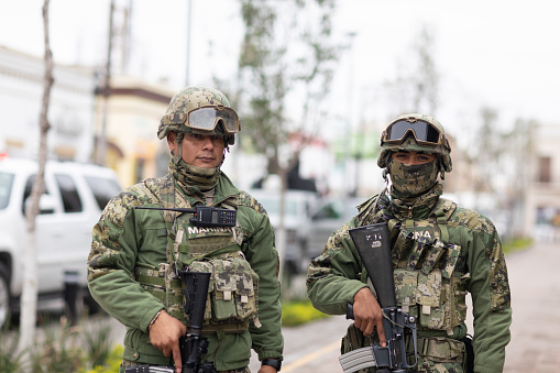 Matamoros, Tamaulipas, Mexico - November 20, 2018: Two Members of the Infanteria de Marina, Mexican Navy stand guard at the Miguel Hidalgo Plaza in Matamoros