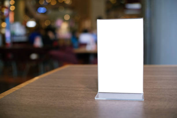 istock Menu frame standing on wood table in Bar restaurant cafe. space for text marketing promotion. 1090446194