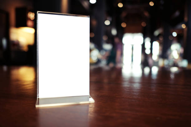istock Menu frame standing on wood table in Bar restaurant cafe. space for text marketing promotion. 1090446224