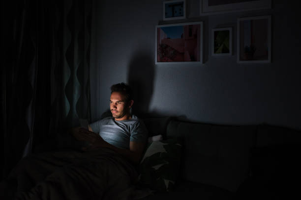 istock Man in pajamas with a mobile phone 1090448946