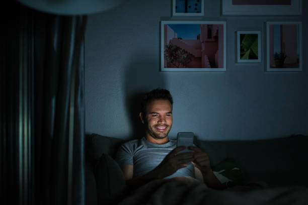 istock Man in pajamas with a mobile phone 1090449508