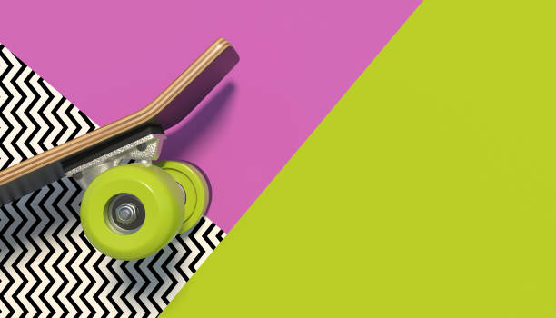 Wooden skateboard with bright colored wheels on a colorful background with geometric patterns. Copy space. Minimalistic creative concept.