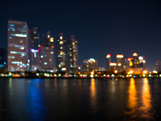 istock Blurred illuminated cityscape by the river 1090450318