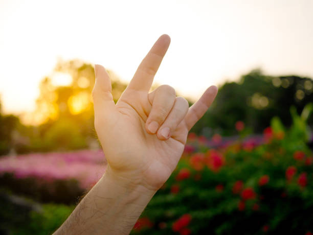 istock A man showing I love you hand sign language 1090450320