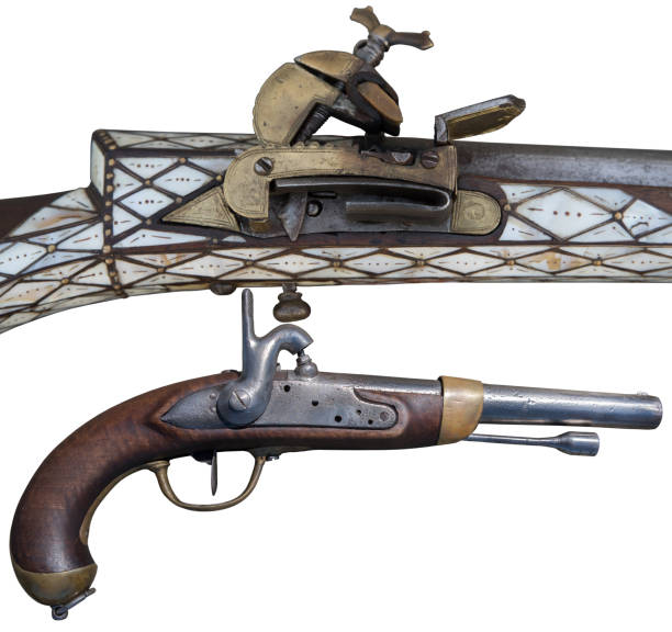 istock Antique flintlock rifle and percussion pistols. Evolution of Firearms. 1090450508