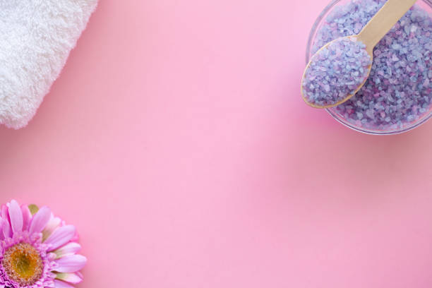 istock Spa. Bath Organic Salt on Wooden Spoon on Pink Background With Copy Space. 1090450588