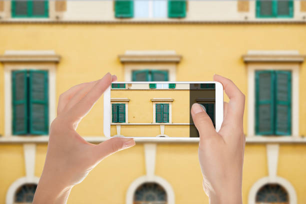 istock A man makes a photo of facade 1090457442