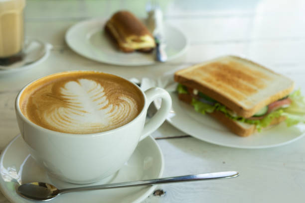 istock A cup of cappuccino and sandwich ham cheese on the plate. 1090458096