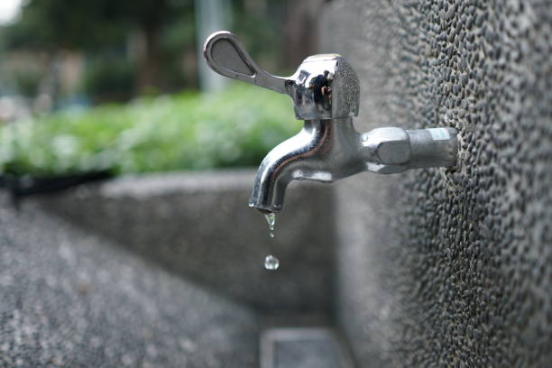 istock Faucet with water in the park. close up. 1090459368