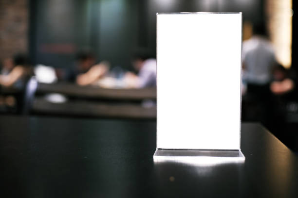 istock Menu frame standing on wood table in Bar restaurant cafe. space for text marketing promotion. 1090460288