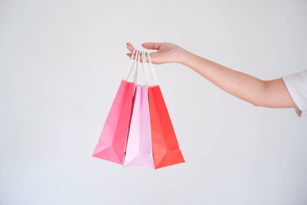 istock woman holding shopping bag 1090460332