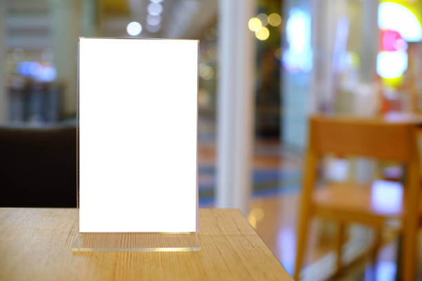 istock Menu frame standing on wood table in Bar restaurant cafe. space for text marketing promotion. 1090460398