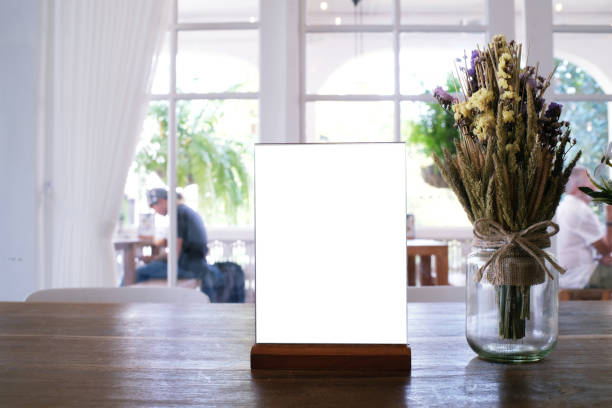 istock Menu frame standing on wood table in Bar restaurant cafe. space for text marketing promotion. 1090460414