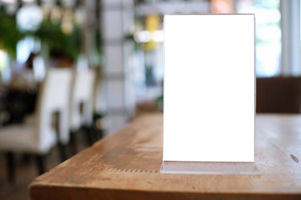 istock Menu frame standing on wood table in Bar restaurant cafe. space for text marketing promotion. 1090460432
