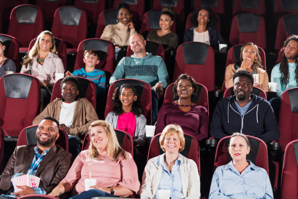 istock Multi-ethnic audience in movie theater 1090463356