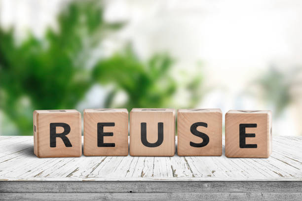 istock Reuse sign on a wooden table in a room 1090465634