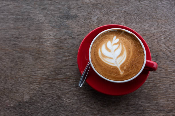 istock Latte art coffee on wooden table, Top view 1090467598