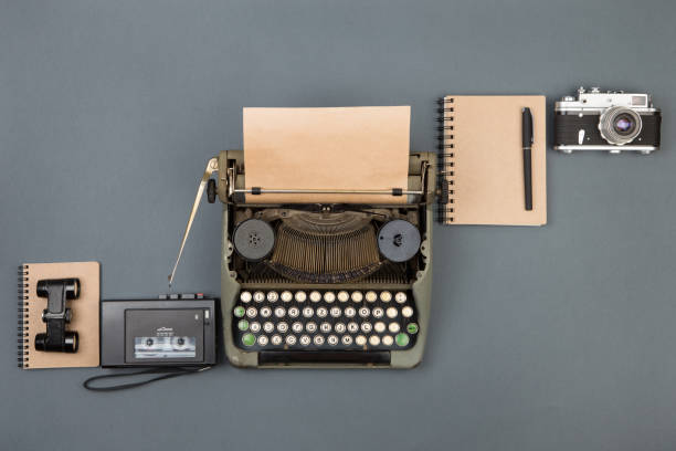 istock Journalist or private detective workplace - typewriter, camera, recorder and other stuff 1090472576