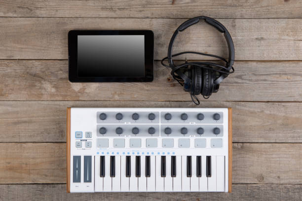 istock Close up of MIDI controller volume fader, knob and keys. 1090472612