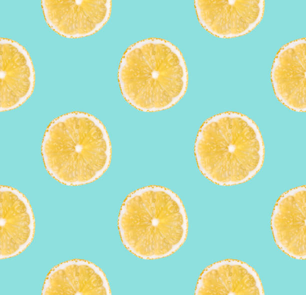 istock Background of fresh yellow lemon slices. Seamless pattern. Close up. Studio photography. 1090475562
