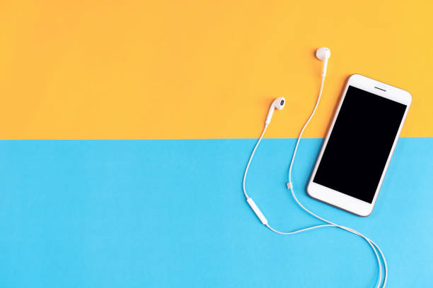 istock Top view, Modern workplace with smartphone placed on pastel background. Copy space suitable for use in graphics. 1090482178