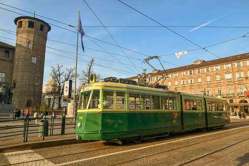 Turin, Piedmont / Italy - December 26 2018: Historical tram in Piazza Castello; the streetcars used for the historical line 7 go all the way back to the '30 and have been completely restored, maintaining all the original parts