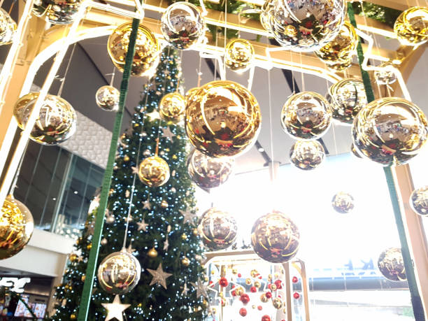 istock Christmas accessories hanging on decorated with lights Christmas tree. 1090482746