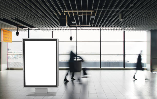 istock Airport passengers crowd walking blurred people billboard advertisement 1090486308
