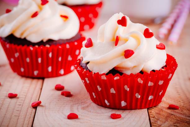 istock Chocolate cupcakes with vanilla cream and red sugar hearts for Valentine's Day 1090487474
