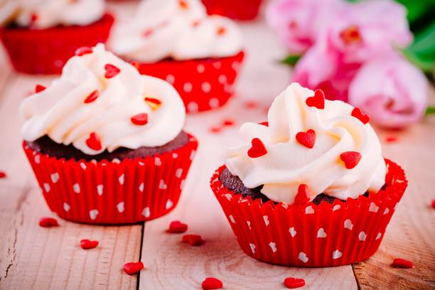 istock Chocolate cupcakes with vanilla cream and red sugar hearts for Valentine's Day 1090487560