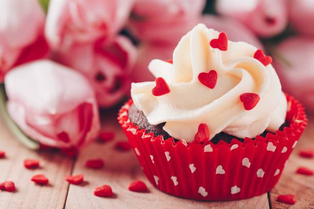 istock Chocolate cupcake with vanilla cream and red sugar hearts for Valentine's Day 1090487762