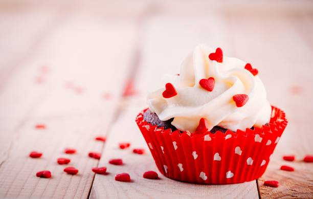 istock Chocolate cupcake with vanilla cream and red sugar hearts for Valentine's Day 1090488042