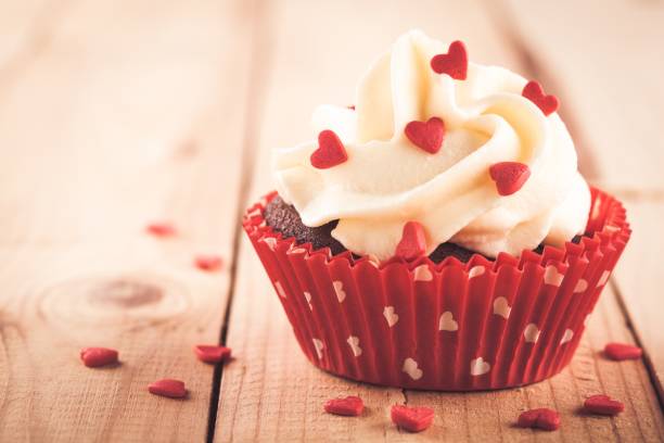 istock Chocolate cupcake with vanilla cream and red sugar hearts for Valentine's Day 1090488090