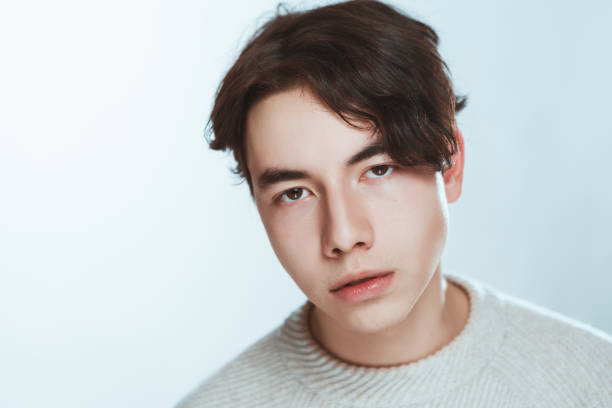 istock Studio portrait young man in grey sweater on white background 1090488310