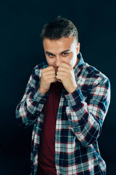 istock portrait of a young man on a dark background 1090488418