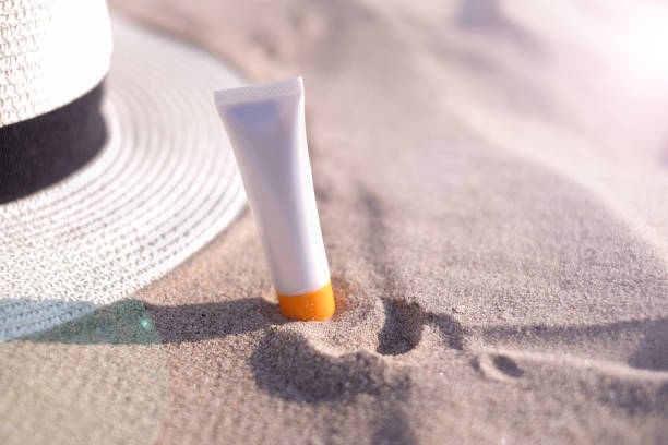 istock woman sunscreen beach summer sun protection. 1090490488