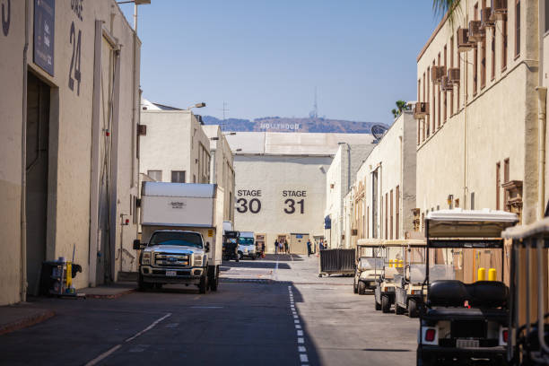 aramount Pictures Studio Tour with Hollywood sign Los Angeles, LA, California, CA, USA, Paramount Pictures - Jul 27, 2018: Paramount Pictures Studio Tour, Stages 30 and 31, with Hollywood sign on the background paramount studios stock pictures, royalty-free photos & images