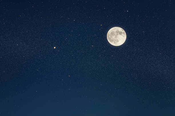 istock Huge full moon on the night sky with bright stars 1090491932