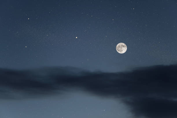 istock Huge full moon on the night sky with bright stars 1090495324