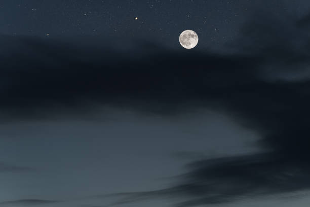 istock Huge full moon on the night sky with bright stars 1090495510