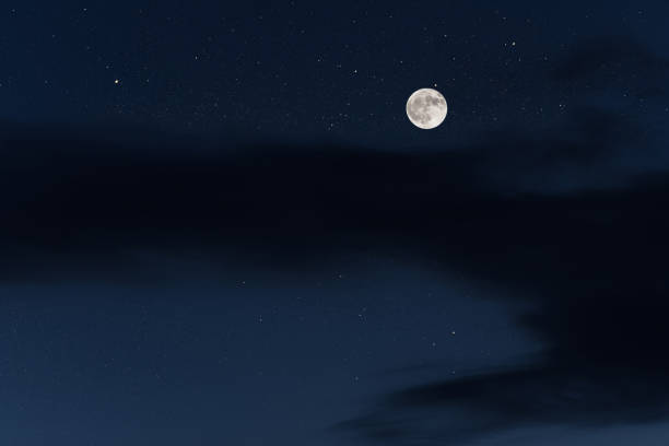 istock Huge full moon on the night sky with bright stars 1090495842